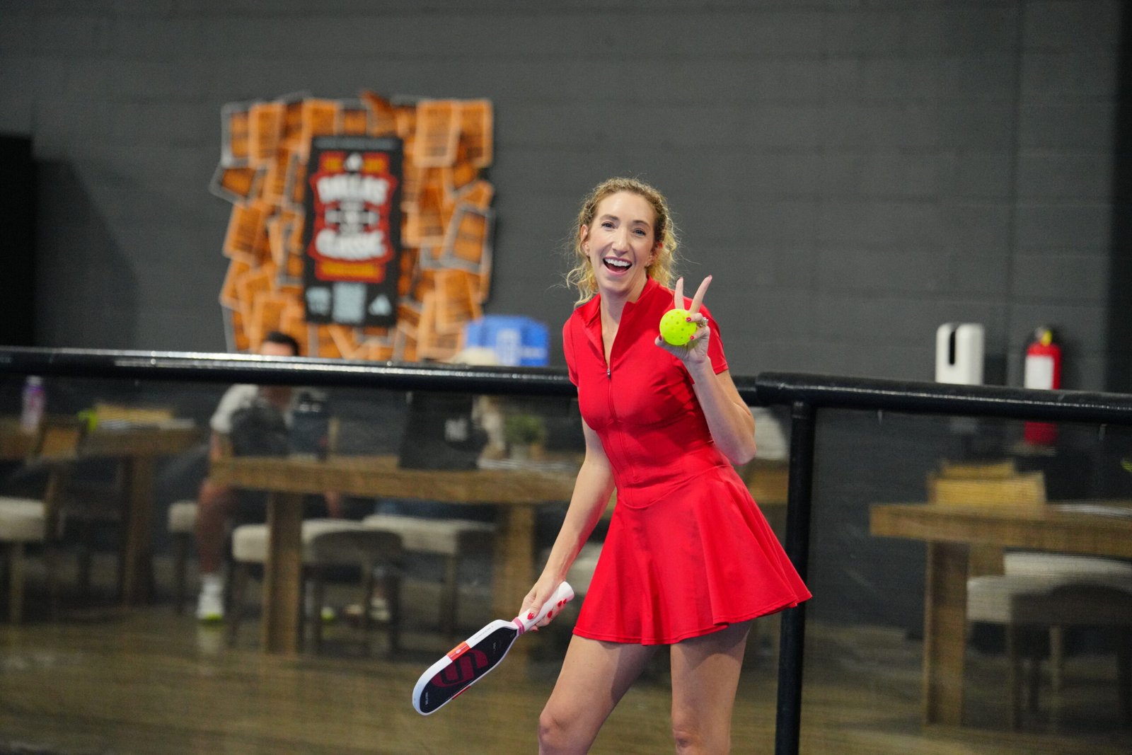 Guest enjoying pickleball at The Grove private event