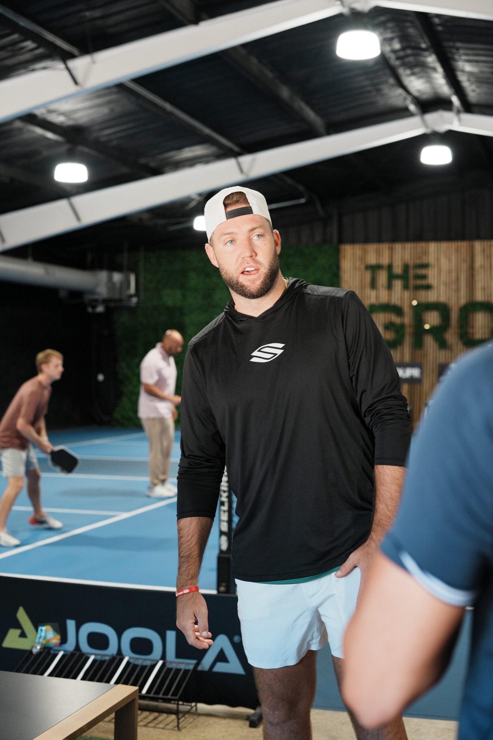 Pickleball play during a Grove gathering