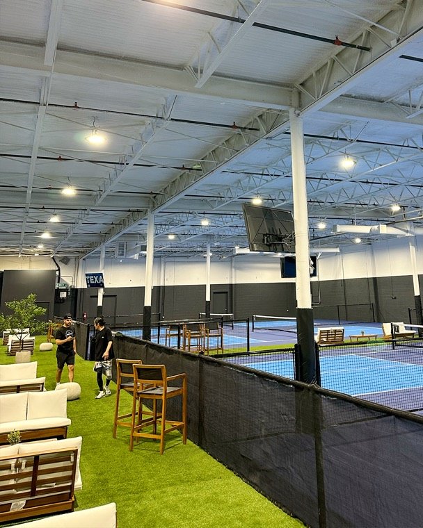 The Grove indoor courts and lounge area